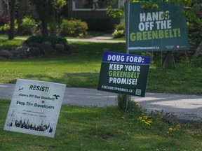 Signboards voicing opposition to the Ontario government's plans for the Greenbelt are seen outside homes within the Duffins Rouge Agricultural Preserve, part of Ontario's Greenbelt, on May 15, 2023.